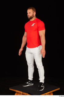 Dave black sneakers dressed red t shirt standing white pants…
